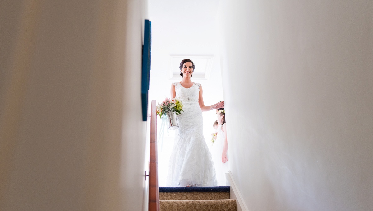 the bride is getting ready - beautiful photo of the bride up stairs - wedding photographe in kerry county kenmare